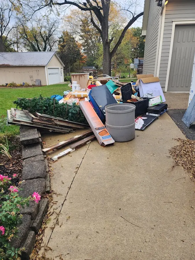 Dumpster being loaded with debris for 3 Yard Dumpster Rental in Salem